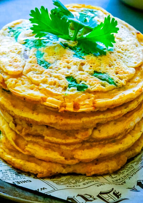 A close-up picture of a stack of five kimchi pancakes.