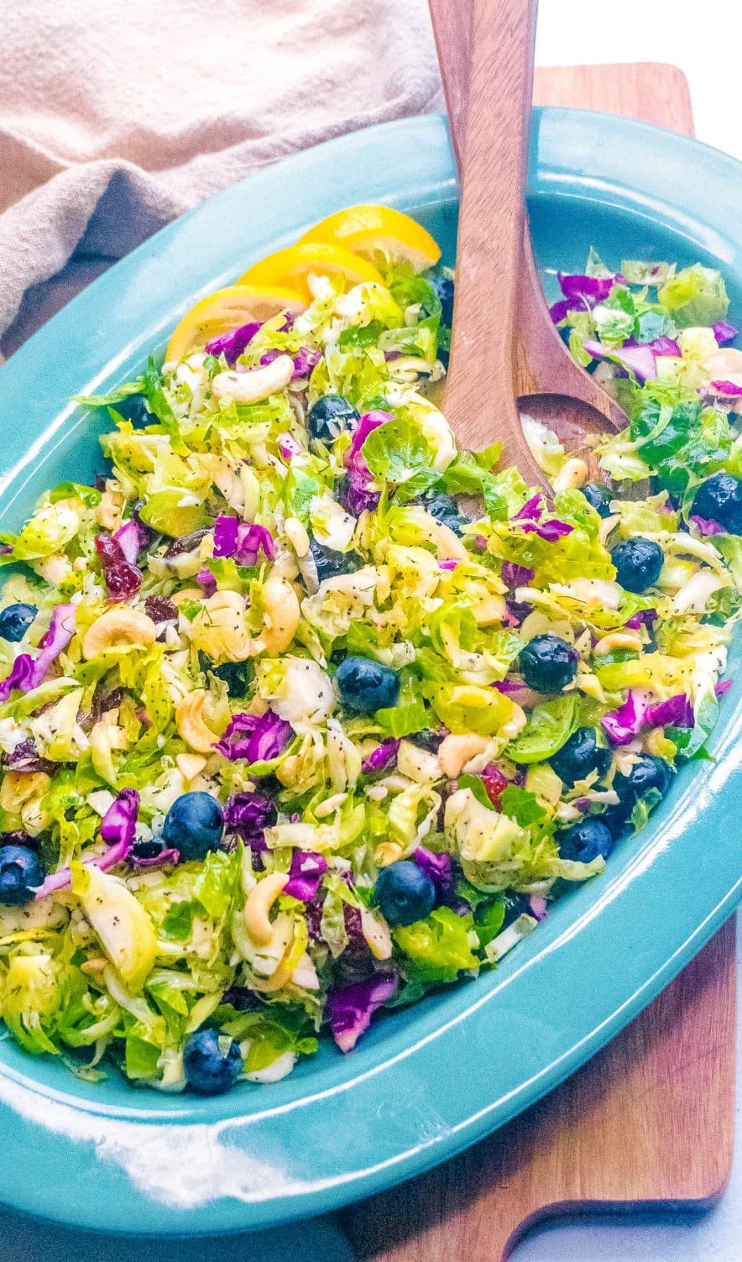 An overhead picture of the finished Brussel Sprout Salad in a blue bowl.