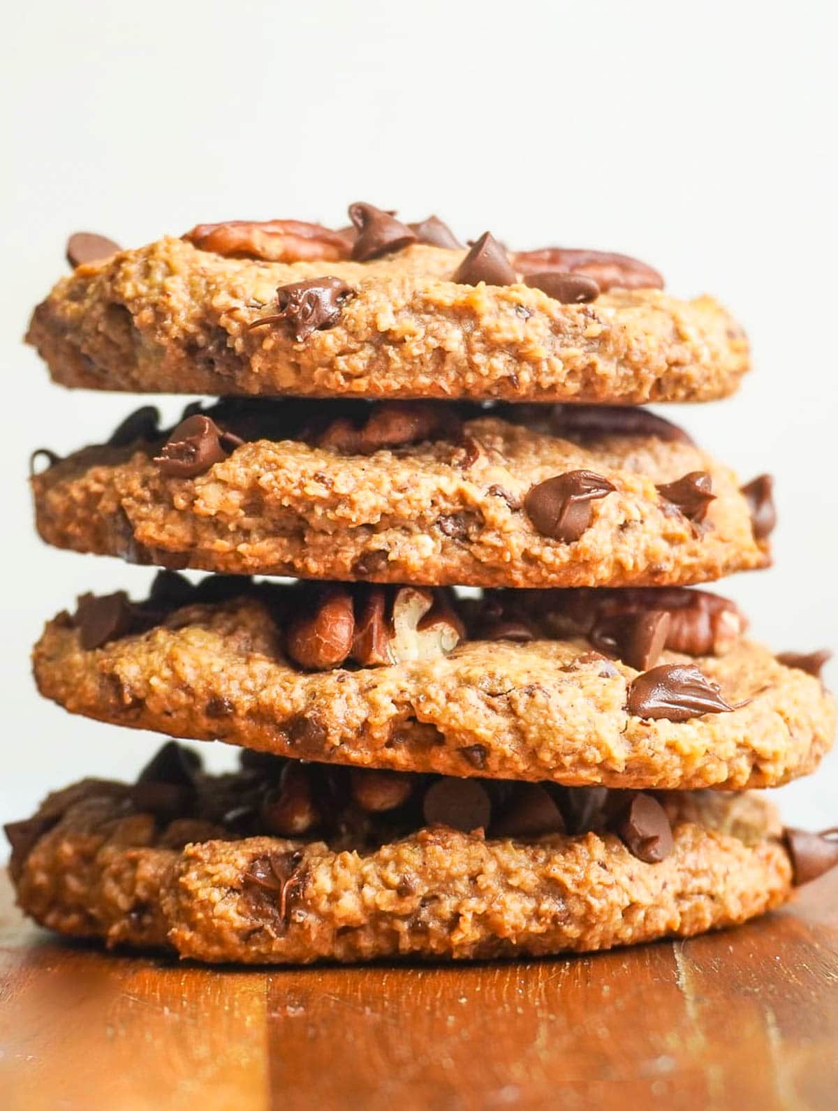 A stack of 4 Chocolate Chip Pecan Cookies. 