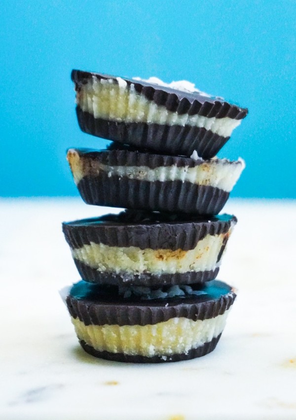 A stack of four coconut butter cups on top of each other.