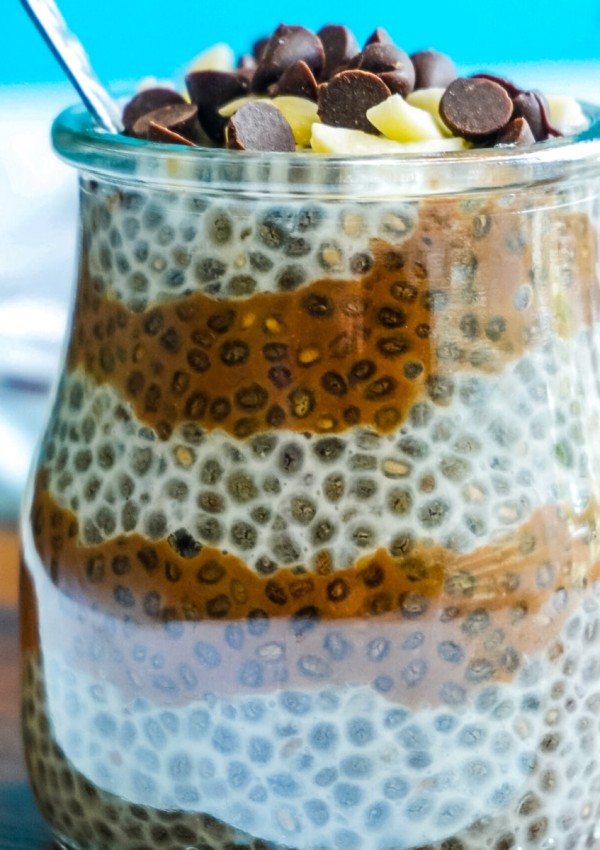 A close up picture of the finished Almond Joy Chia Pudding in a glass jar.