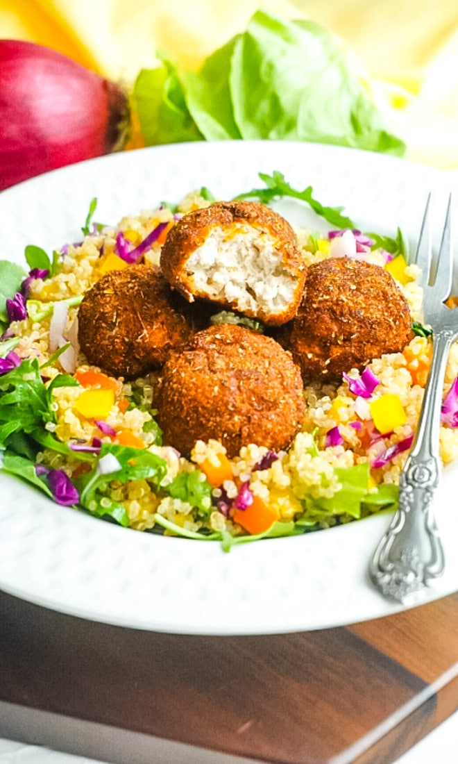 Gluten-Free Chicken Meatballs on top of salad.