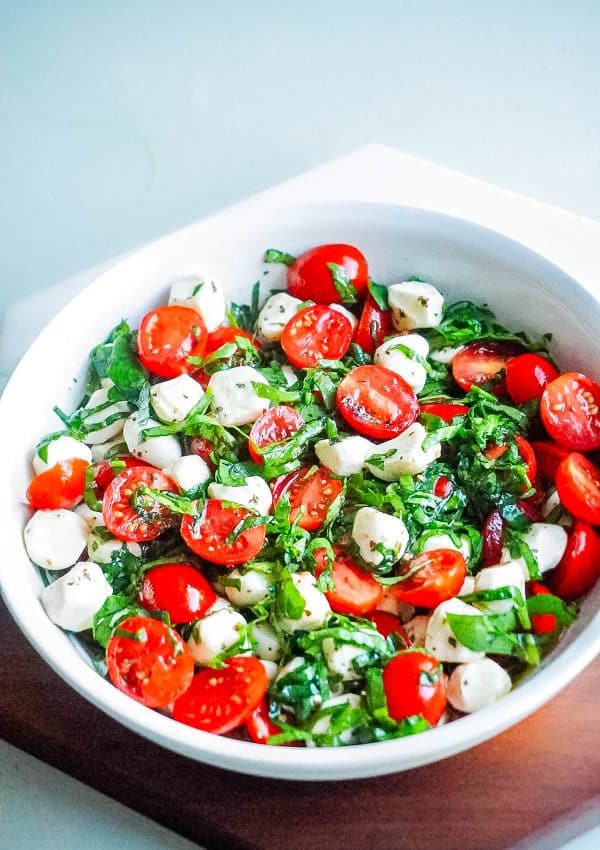 The finished Easy Caprese Salad in a white bowl.