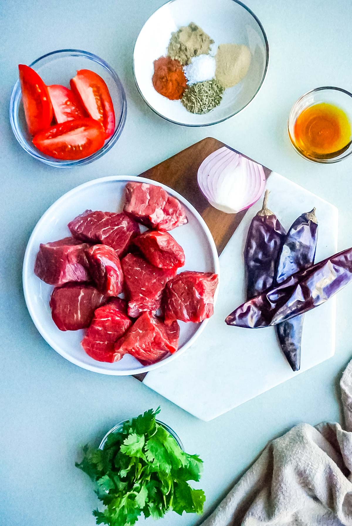 An overhead picture of all of the ingredients needed to make this Instant Pot Mexican Beef recipe.