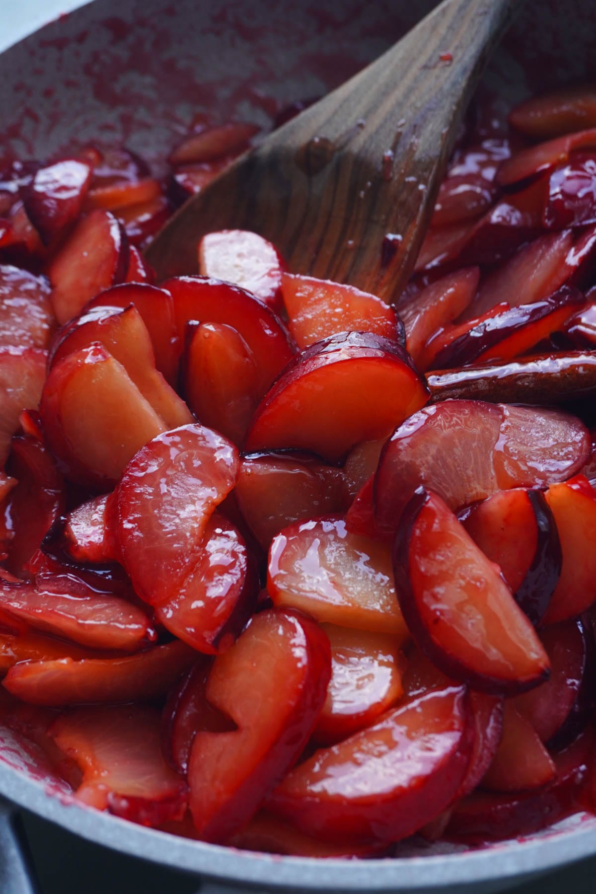 cooked plums in a pan
