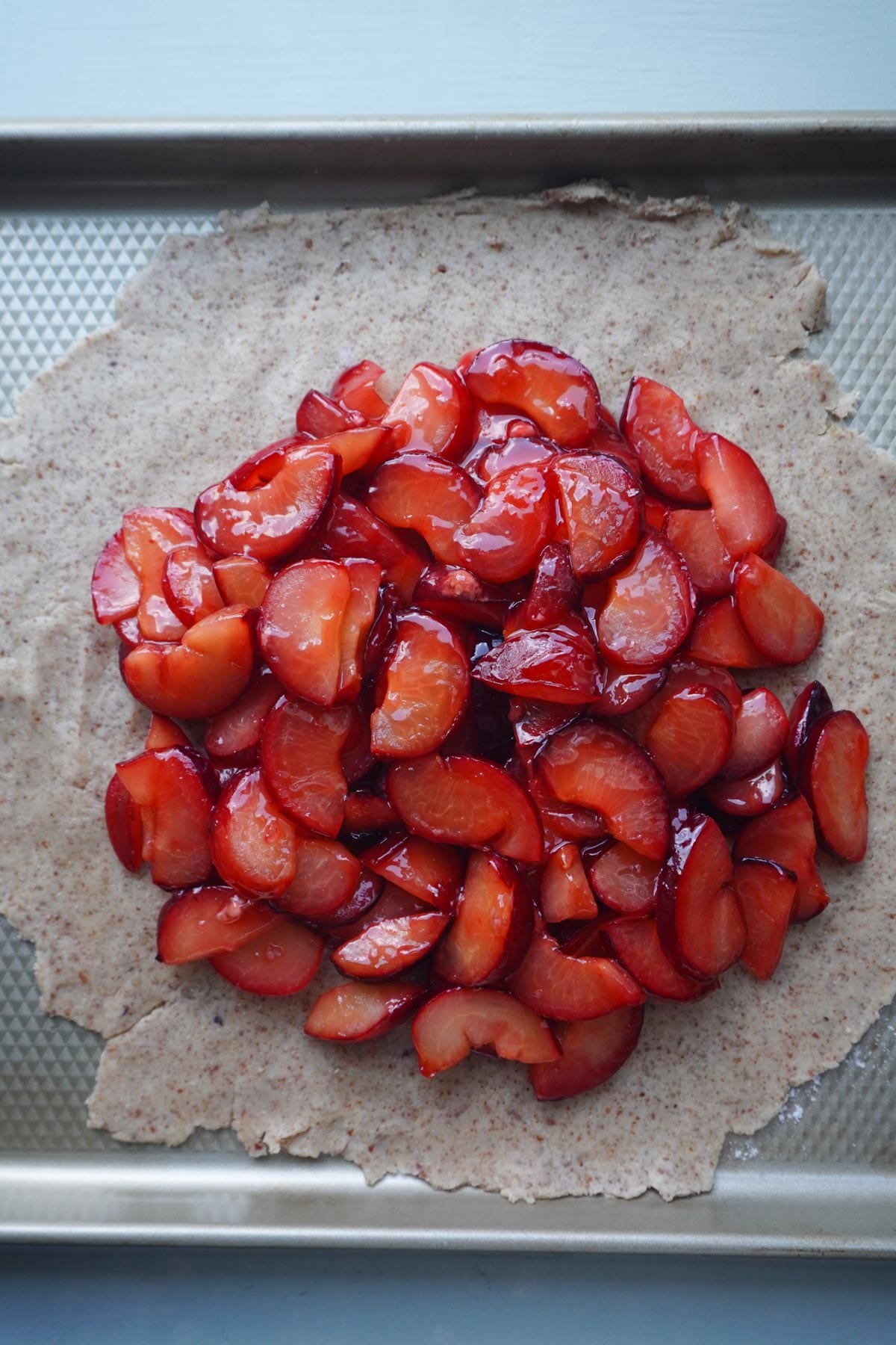galette dough on a baking sheet with fruit