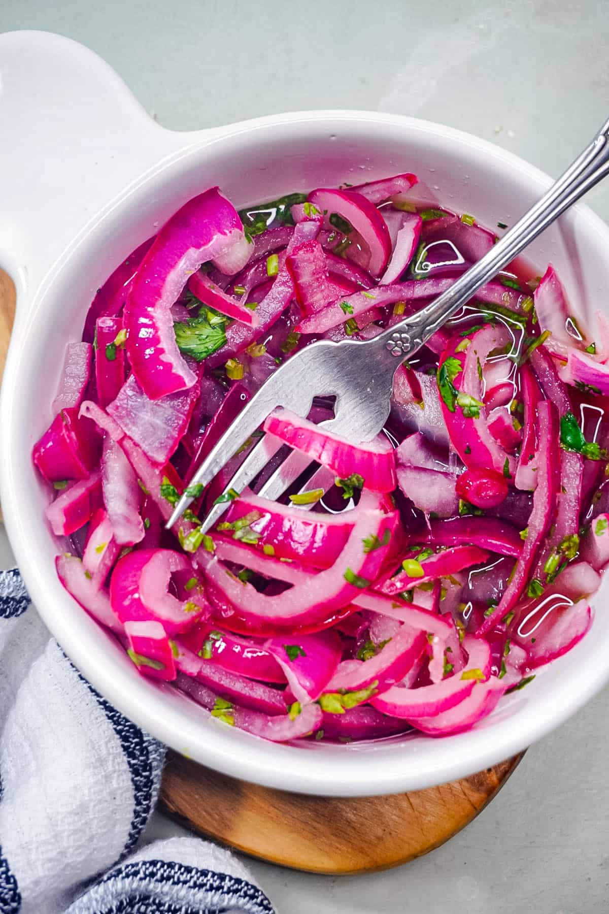A bowl of the red pickled onions needed for the breakfast tacos.
