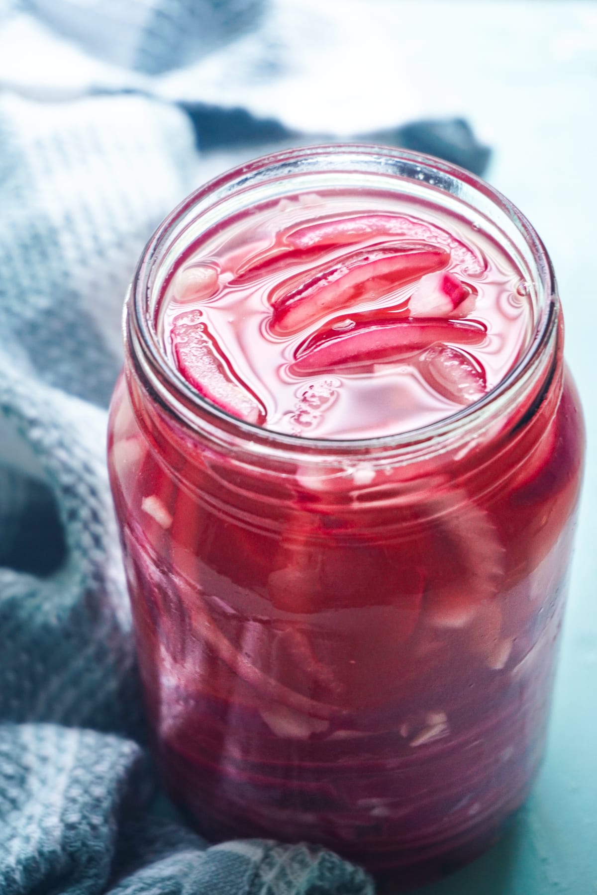 pickled red onions in a glass jar
