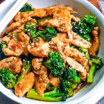 An overhead picture of the finished Chinese Chicken and Broccoli in a white serving bowl.