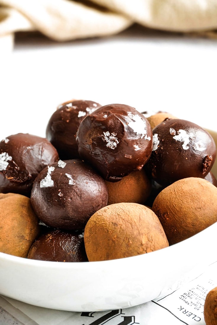 A close up picture of a bowl full of Vegan Chocolate Truffles.