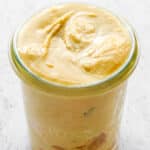 A close up picture of the coconut cashew butter in a glass jar.