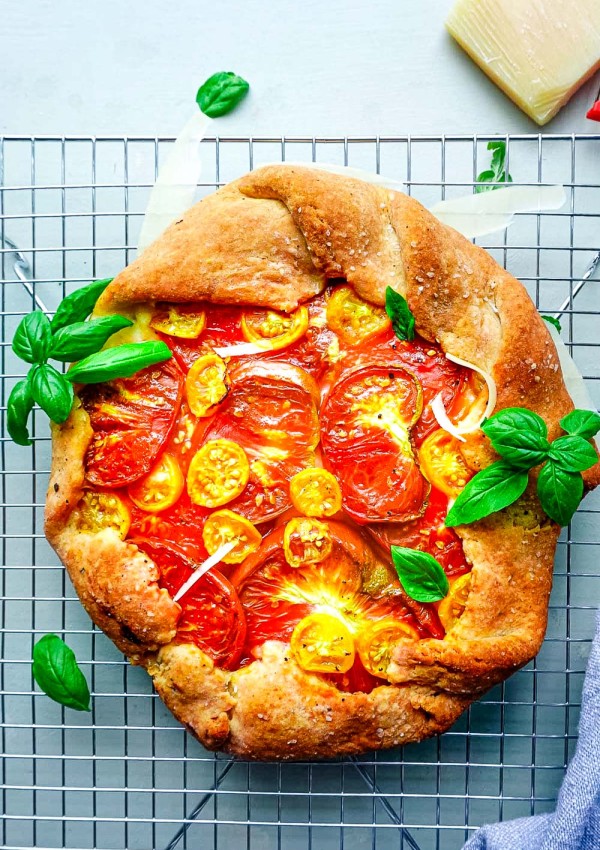 An overhead picture of the finished Tomato Galette on a wire rack.