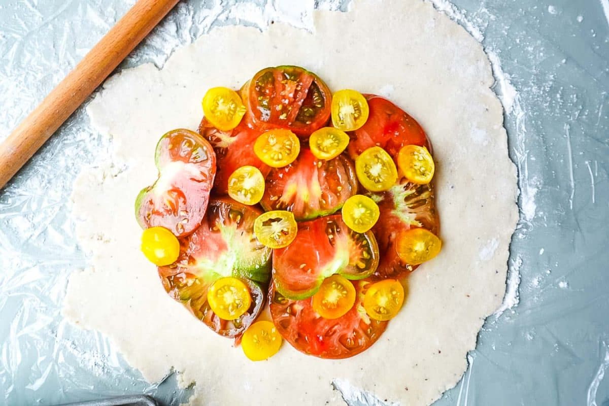 Heirloom tomatoes on top of a galette crust.
