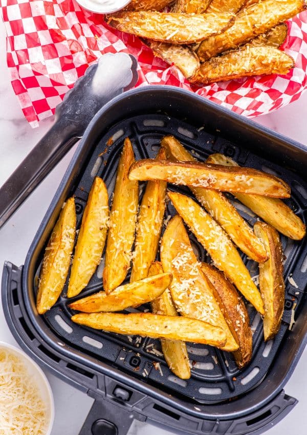 The finished Air Fryer Potato Wedges in an air fryer basket.