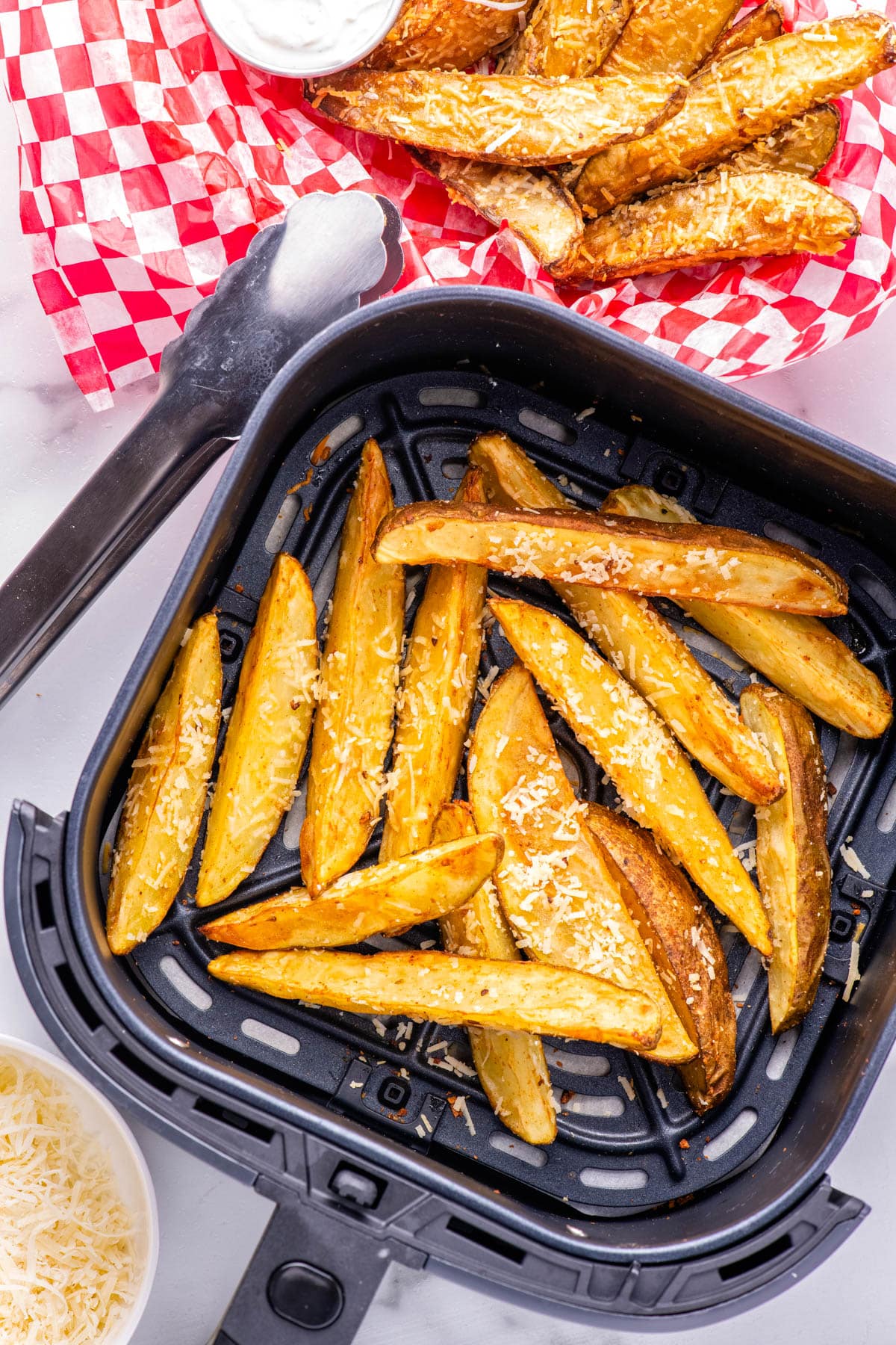 The finished Air Fryer Potato Wedges in an air fryer basket. 