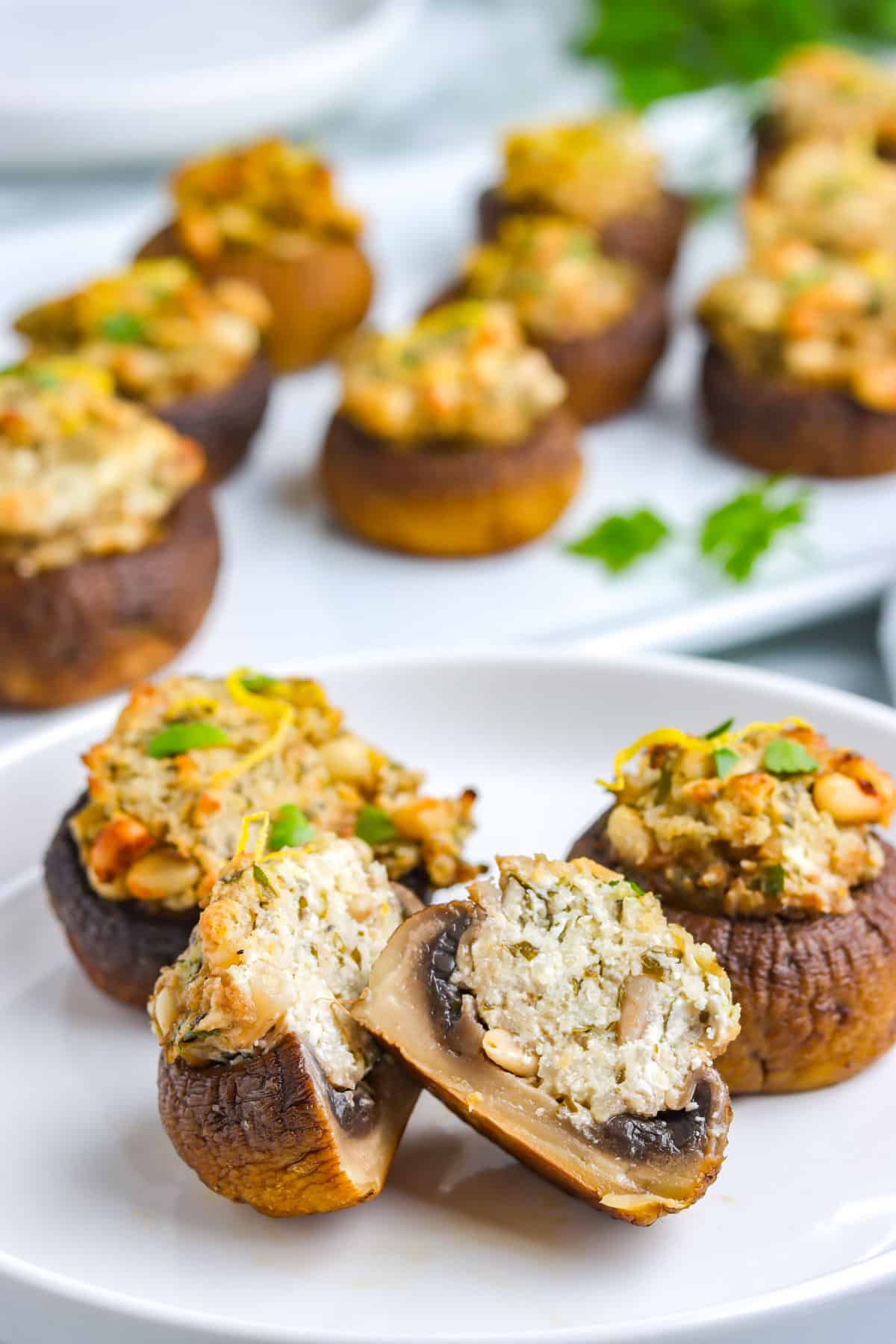 A Stuffed Mushroom With Goach Cheese cut in half so you can see the interior of the mushrooms.
