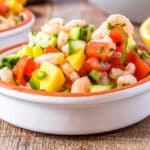 A close up of ceviche in a white bowl.