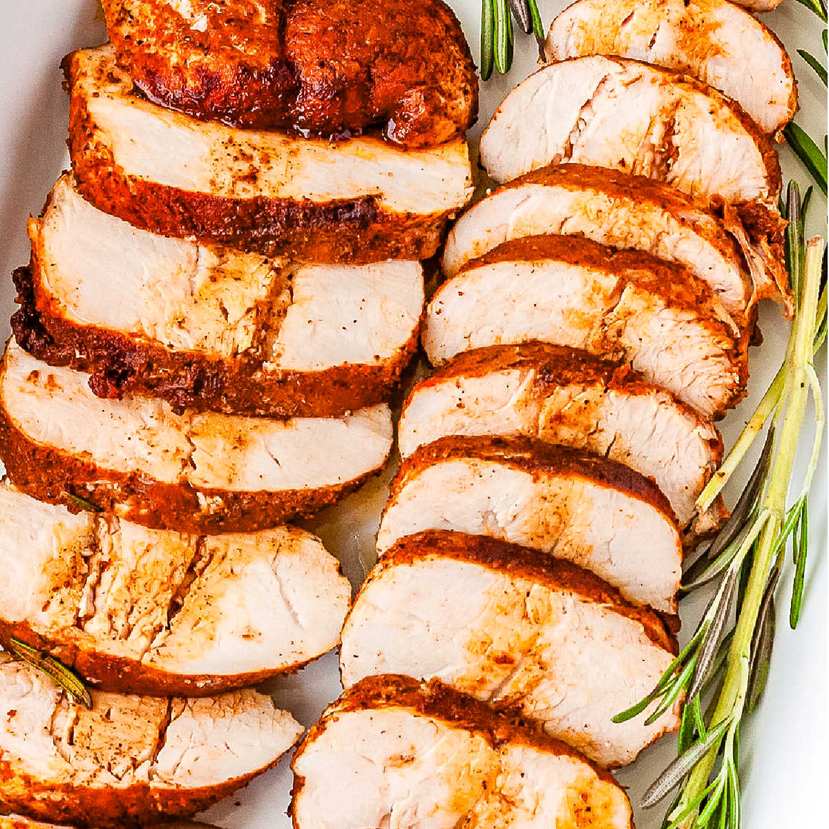 Slices of tenderloin with pan drippings spooned over them.