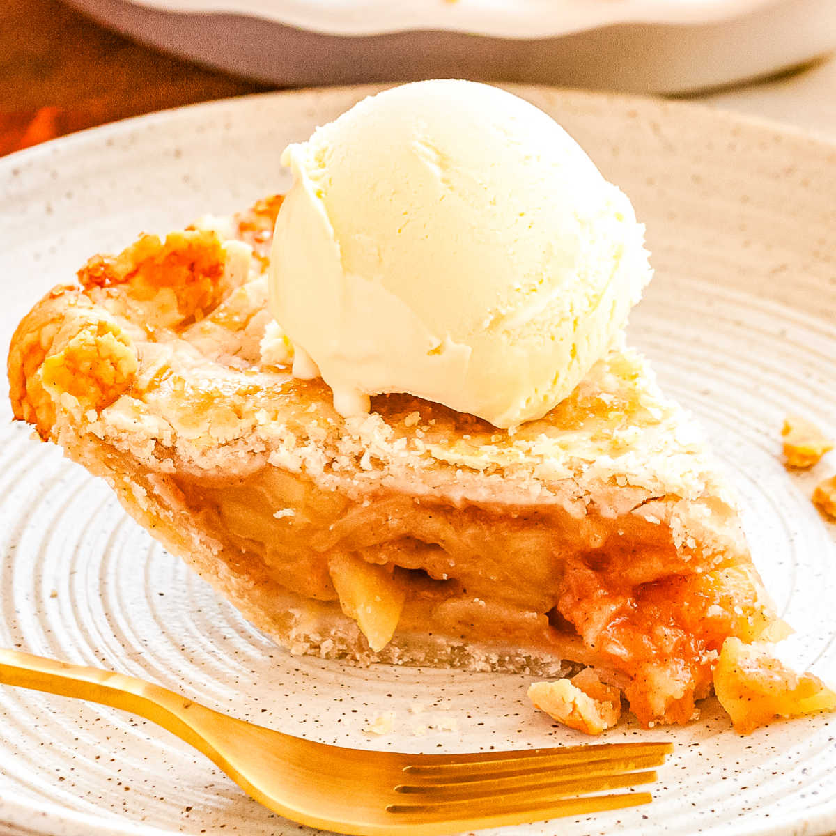 A slice of gluten-free apple pie on a white plate.