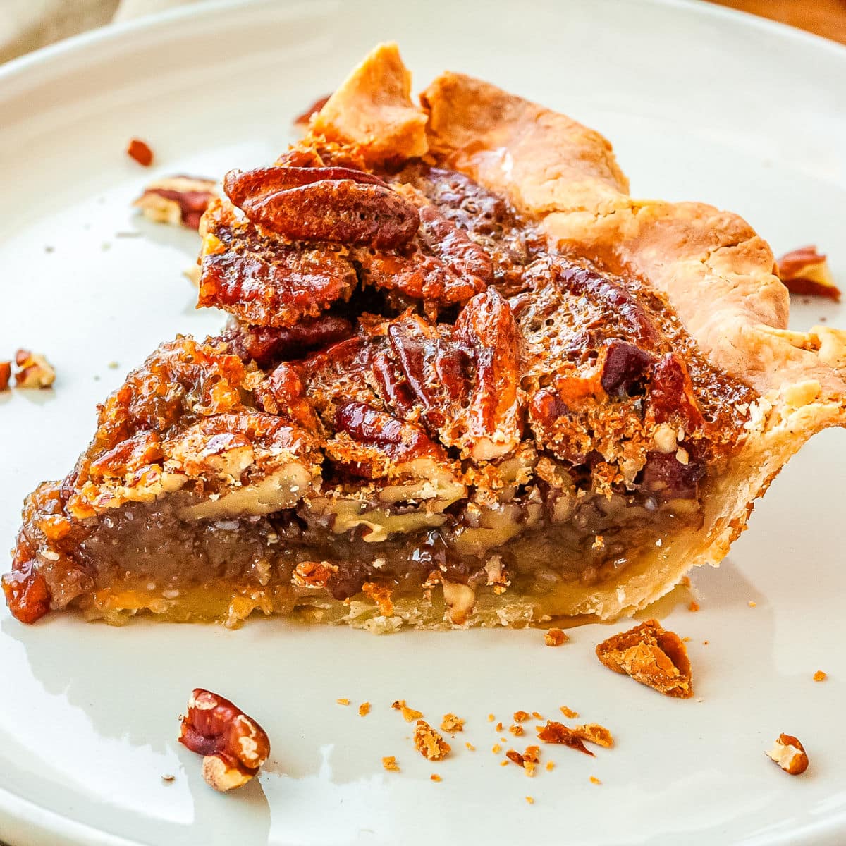 A slice of the gluten free pecan pie recipe on a white plate.