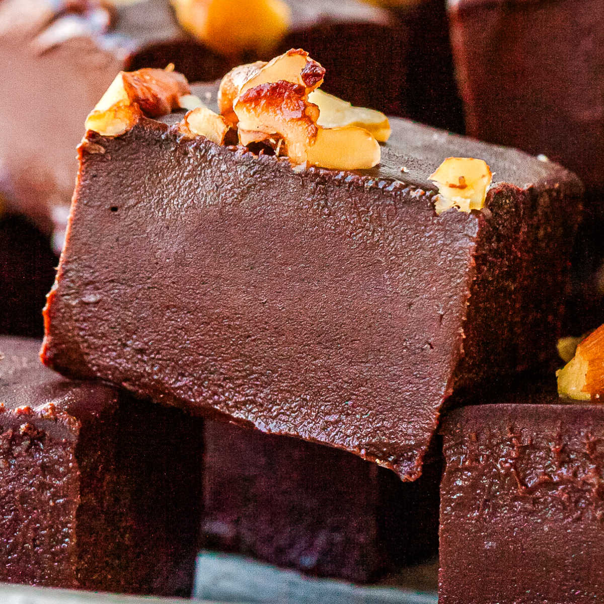 Pieces of healthy chocolate fudge stched on each other.