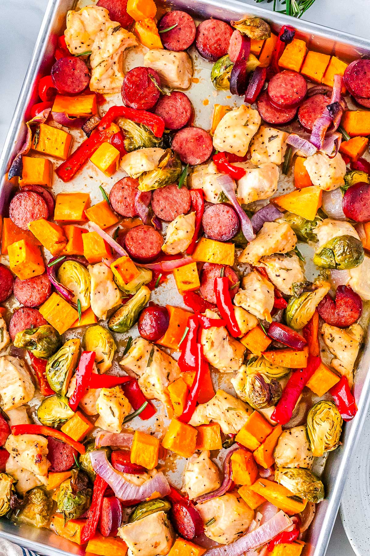 The finished sheet pan chicken sausage and veggies ready to be served.